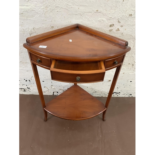 55 - A Bradley yew wood two tier corner occasional table - approx. 80cm high x 59cm wide x 41cm deep