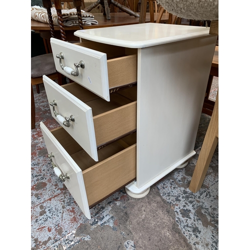 58 - A modern white painted bedside chest of drawers