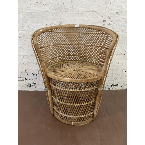 62 - A mid 20th century wicker peacock chair - approx. 75cm high x 62cm wide x 47cm deep