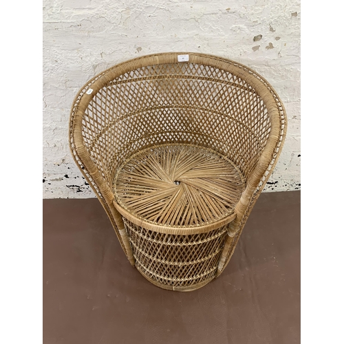 62 - A mid 20th century wicker peacock chair - approx. 75cm high x 62cm wide x 47cm deep