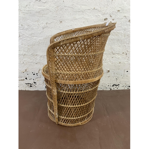 62 - A mid 20th century wicker peacock chair - approx. 75cm high x 62cm wide x 47cm deep