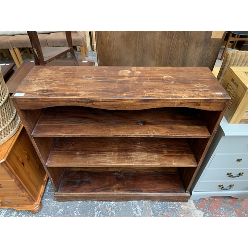 63 - A modern hardwood three tier bookcase - approx. 90cm high x 92cm wide x 29cm deep