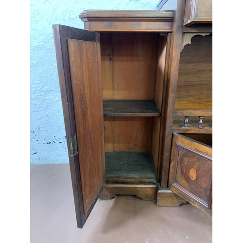 69 - A late 19th/early 20th century inlaid walnut sideboard with two mirrored cupboard doors - approx. 92... 