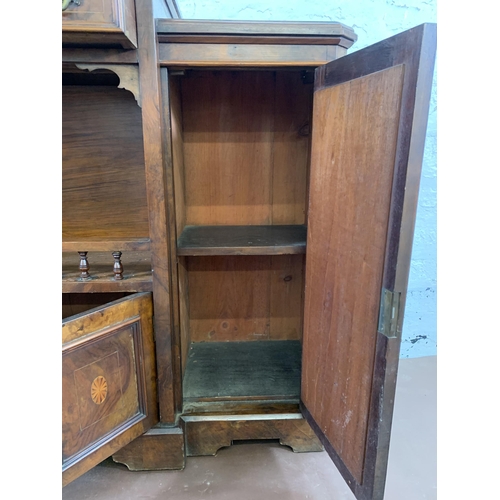 69 - A late 19th/early 20th century inlaid walnut sideboard with two mirrored cupboard doors - approx. 92... 