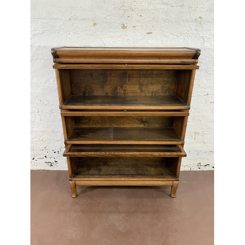 70 - An early 20th century Globe-Wernicke oak three section stacking bookcase - approx. 116cm high x 87cm... 