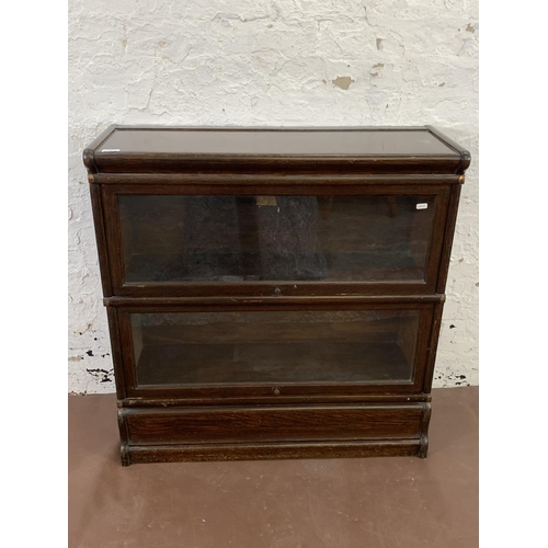 71 - An early 20th century Globe-Wernicke oak two section stacking bookcase - approx. 89cm high x 87cm wi... 