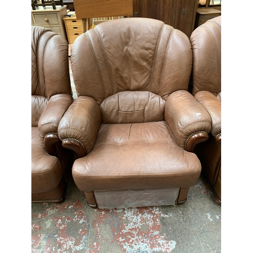 77 - A modern brown leather and stained beech three piece lounge suite comprising three seater sofa and t... 