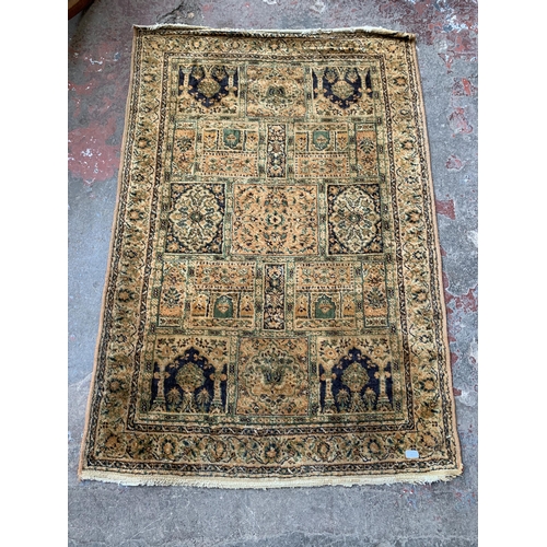 82 - A mid/late 20th century machine woven rug - approx. 170cm x 114cm