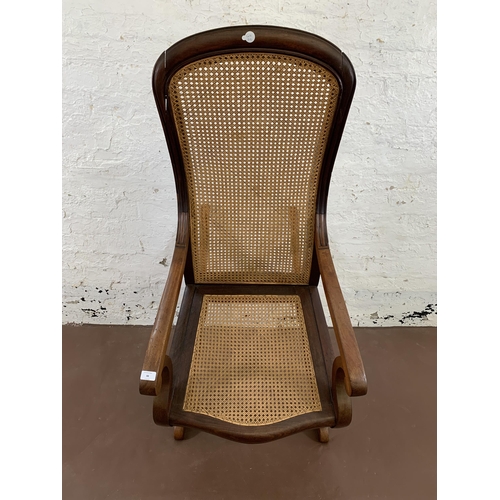 88 - A Victorian mahogany and cane 'Lincoln' rocking chair