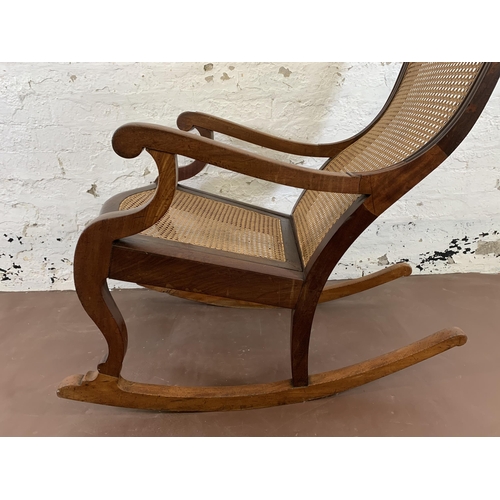 88 - A Victorian mahogany and cane 'Lincoln' rocking chair