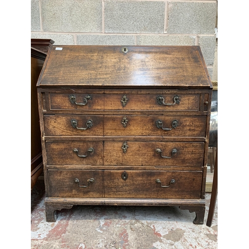 9 - A Georgian mahogany bureau on bracket supports - approx. 102cm high x 91cm wide x 45cm deep