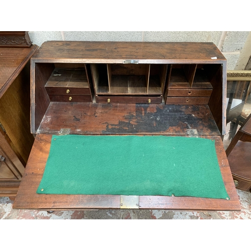 9 - A Georgian mahogany bureau on bracket supports - approx. 102cm high x 91cm wide x 45cm deep