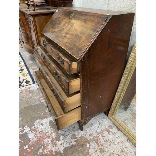 9 - A Georgian mahogany bureau on bracket supports - approx. 102cm high x 91cm wide x 45cm deep