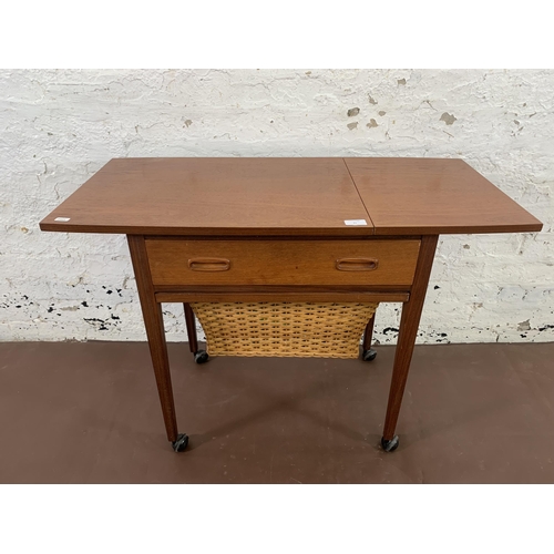 91 - A 1960s Danish teak sewing table with wicker basket - approx. 68cm high x 60cm wide x 42cm deep