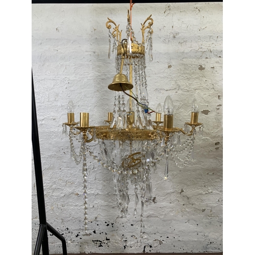 96 - A modern gilt metal and crystal six branch chandelier - approx. 94cm drop x 66cm diameter