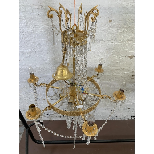 96 - A modern gilt metal and crystal six branch chandelier - approx. 94cm drop x 66cm diameter