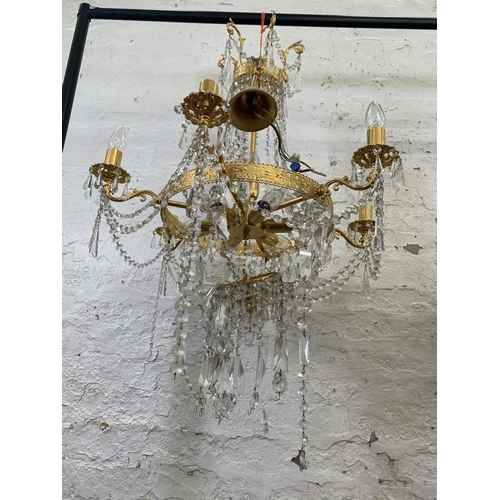 96 - A modern gilt metal and crystal six branch chandelier - approx. 94cm drop x 66cm diameter