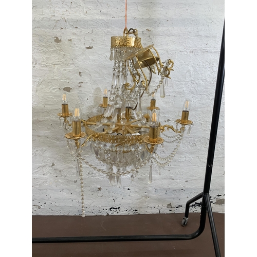 97 - A modern gilt metal and crystal six branch chandelier - approx. 100cm drop x 66cm diameter