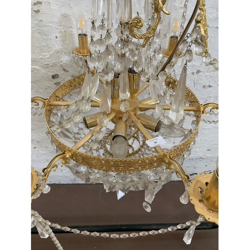 97 - A modern gilt metal and crystal six branch chandelier - approx. 100cm drop x 66cm diameter