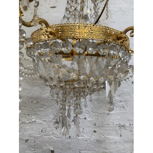 97 - A modern gilt metal and crystal six branch chandelier - approx. 100cm drop x 66cm diameter