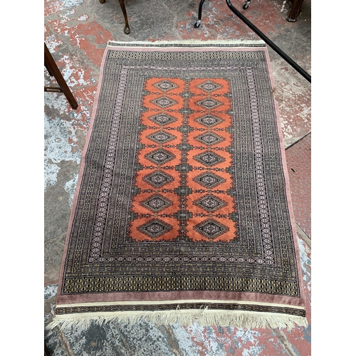 97A - A mid/late 20th century Persian machine woven rug - approx. 190cm x 125cm