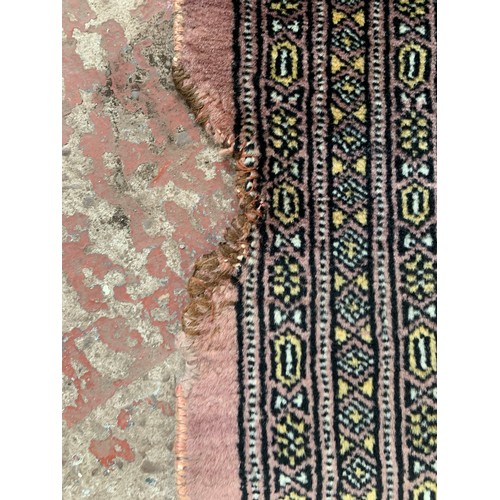 97A - A mid/late 20th century Persian machine woven rug - approx. 190cm x 125cm