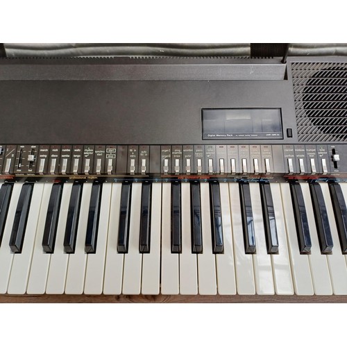 A cased Technics SX-K200 electronic keyboard