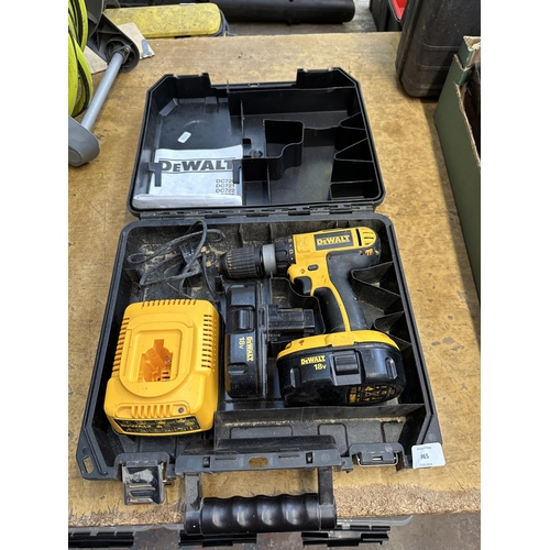 965 - A cased DeWalt DC725 18v cordless drill with two batteries and charger