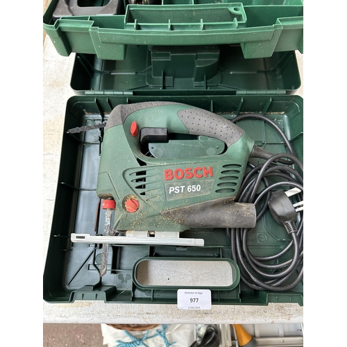 977 - Three cased power tools, Bosch PST650 jigsaw, Bosch PSR12 cordless drill and Power Craft PSD-480K sc... 