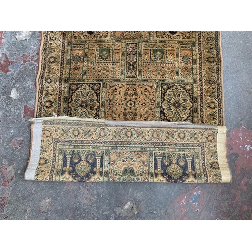 82 - A mid/late 20th century machine woven rug - approx. 170cm x 114cm