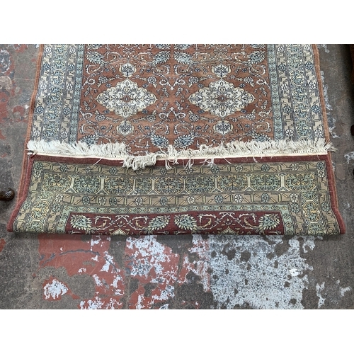 97B - A mid/late 20th century Persian machine woven rug - approx. 190cm x 125cm