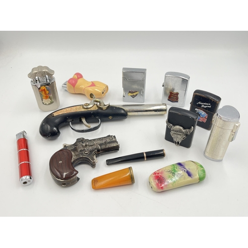 2061 - A collection of cheroot holders and cigarette lighters