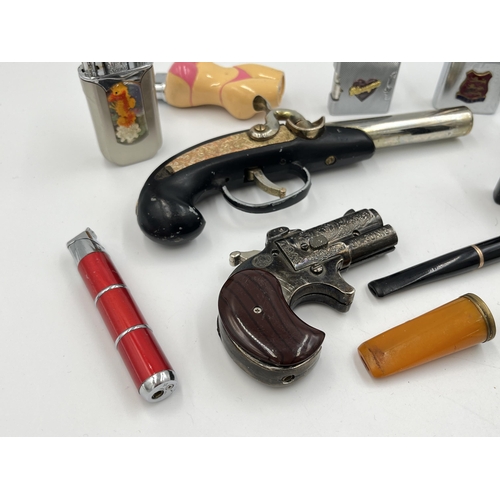 2061 - A collection of cheroot holders and cigarette lighters