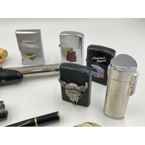 2061 - A collection of cheroot holders and cigarette lighters