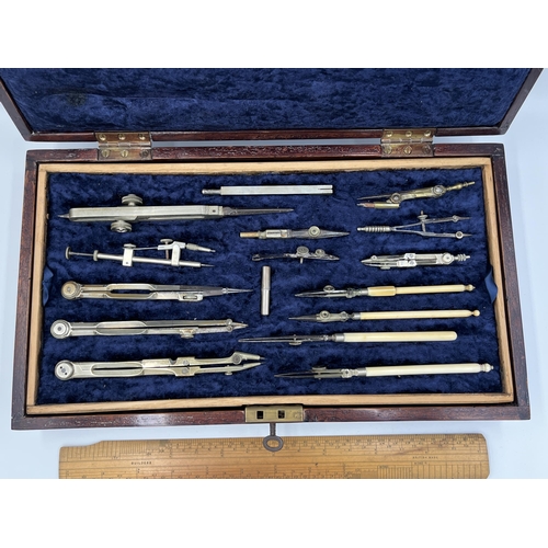 2063 - A late 19th/early 20th century mahogany cased precision drawing set