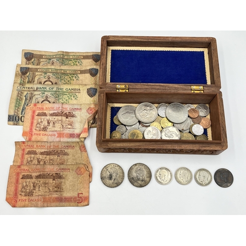 2067 - A collection of Gambian banknotes and world coins to include two 50% silver crowns, 40% silver 1967 ... 