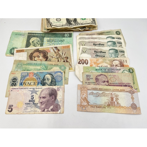 2068 - A collection of world banknotes to include Central Bank of Kenya, United Arab Emirates Central Bank,... 