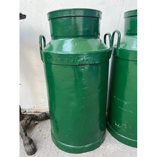 150A - A pair of vintage Co-op Society Ltd green painted galvanised milk churns - approx. 72cm high