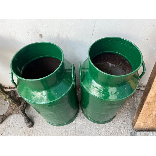 150A - A pair of vintage Co-op Society Ltd green painted galvanised milk churns - approx. 72cm high