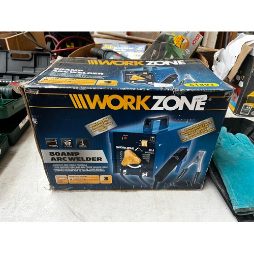 976A - A boxed WorkZone 61893 80amp arc welder with mask and gloves