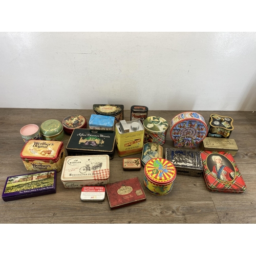 407 - A collection of vintage tins to include Huntley & Palmers, Furniss Humbugs etc.