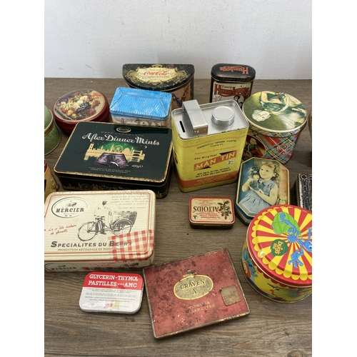 407 - A collection of vintage tins to include Huntley & Palmers, Furniss Humbugs etc.