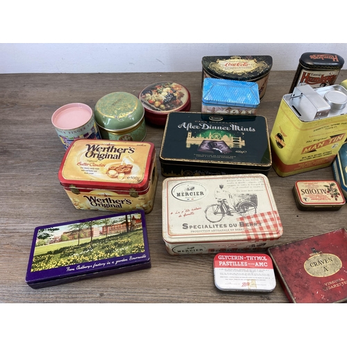 407 - A collection of vintage tins to include Huntley & Palmers, Furniss Humbugs etc.