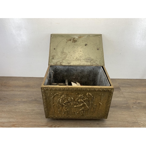 409 - A mid 20th century embossed brass coal box - approx. 29cm high x 40.5cm wide x 28cm deep