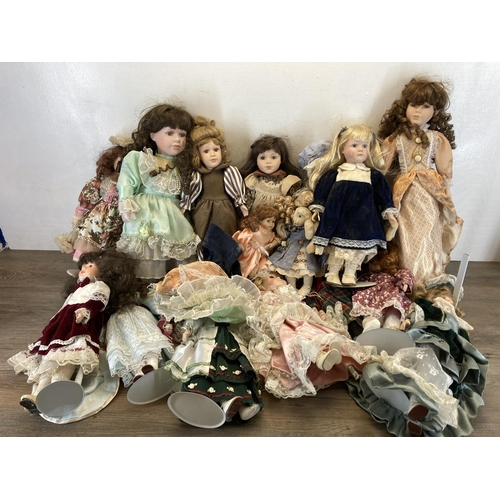 438 - A collection of porcelain headed dolls