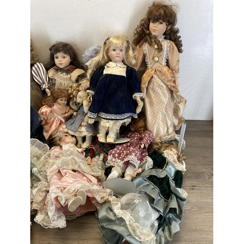 438 - A collection of porcelain headed dolls