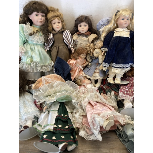 438 - A collection of porcelain headed dolls