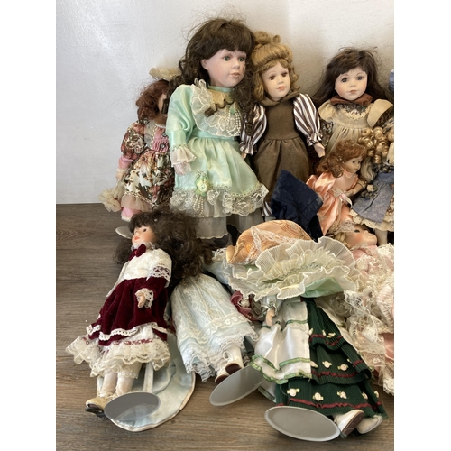 438 - A collection of porcelain headed dolls