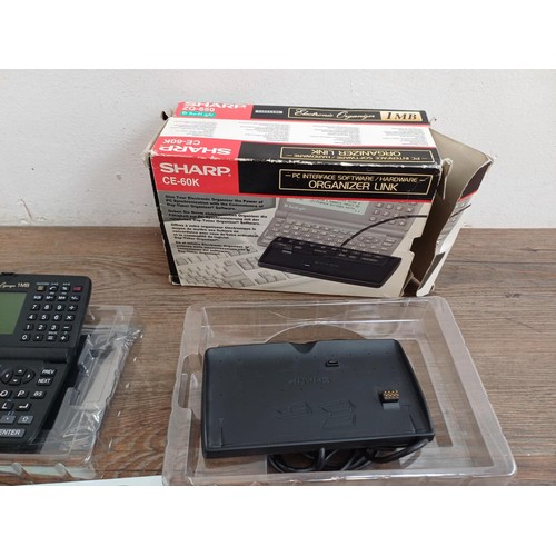 807 - A boxed Sharp ZQ-650 1mb electronic organizer and CE-60K organizer link with ten floppy discs