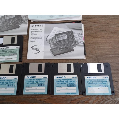 807 - A boxed Sharp ZQ-650 1mb electronic organizer and CE-60K organizer link with ten floppy discs